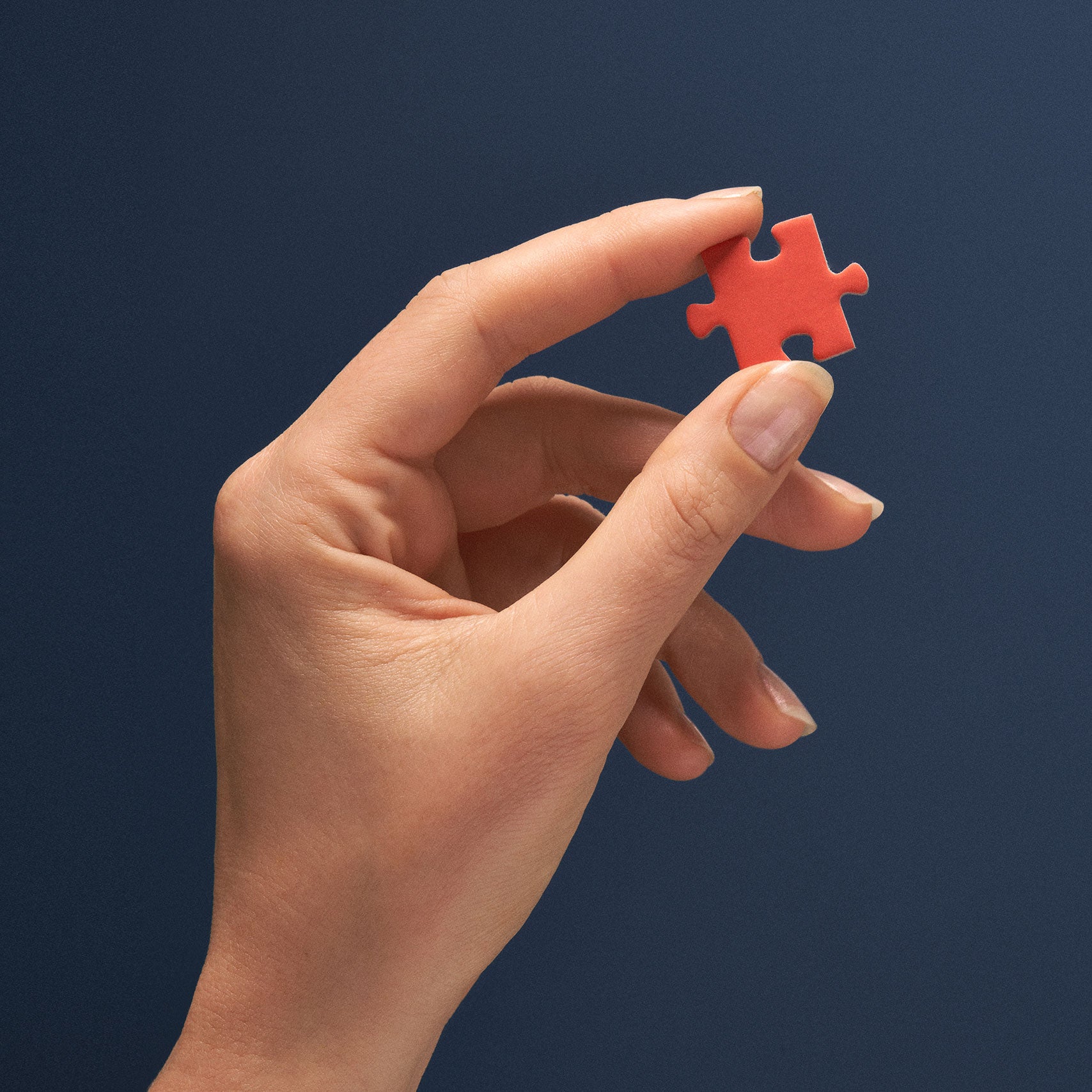 Hand with puzzle piece